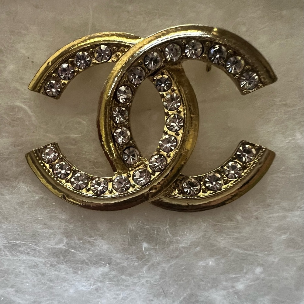 Costume C's GoldTone and Silver Crystal Brooch